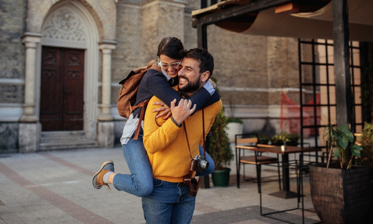 Happy couple overcoming cross-cultural dating challenges together